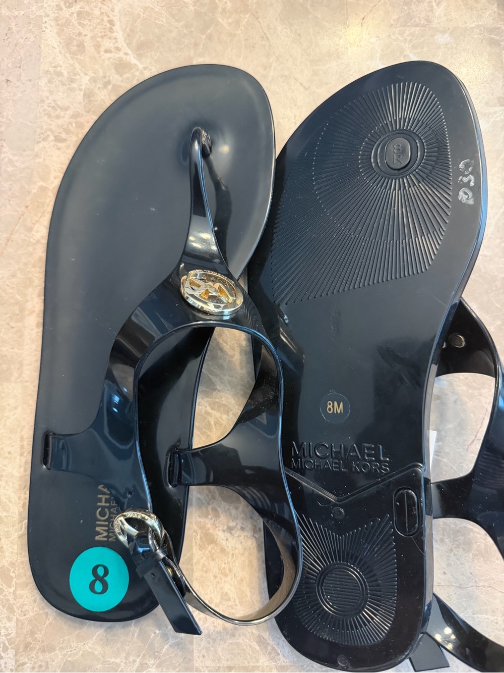Michael Kors Black Jelly Logo Thong Sandals with Gold Emblem